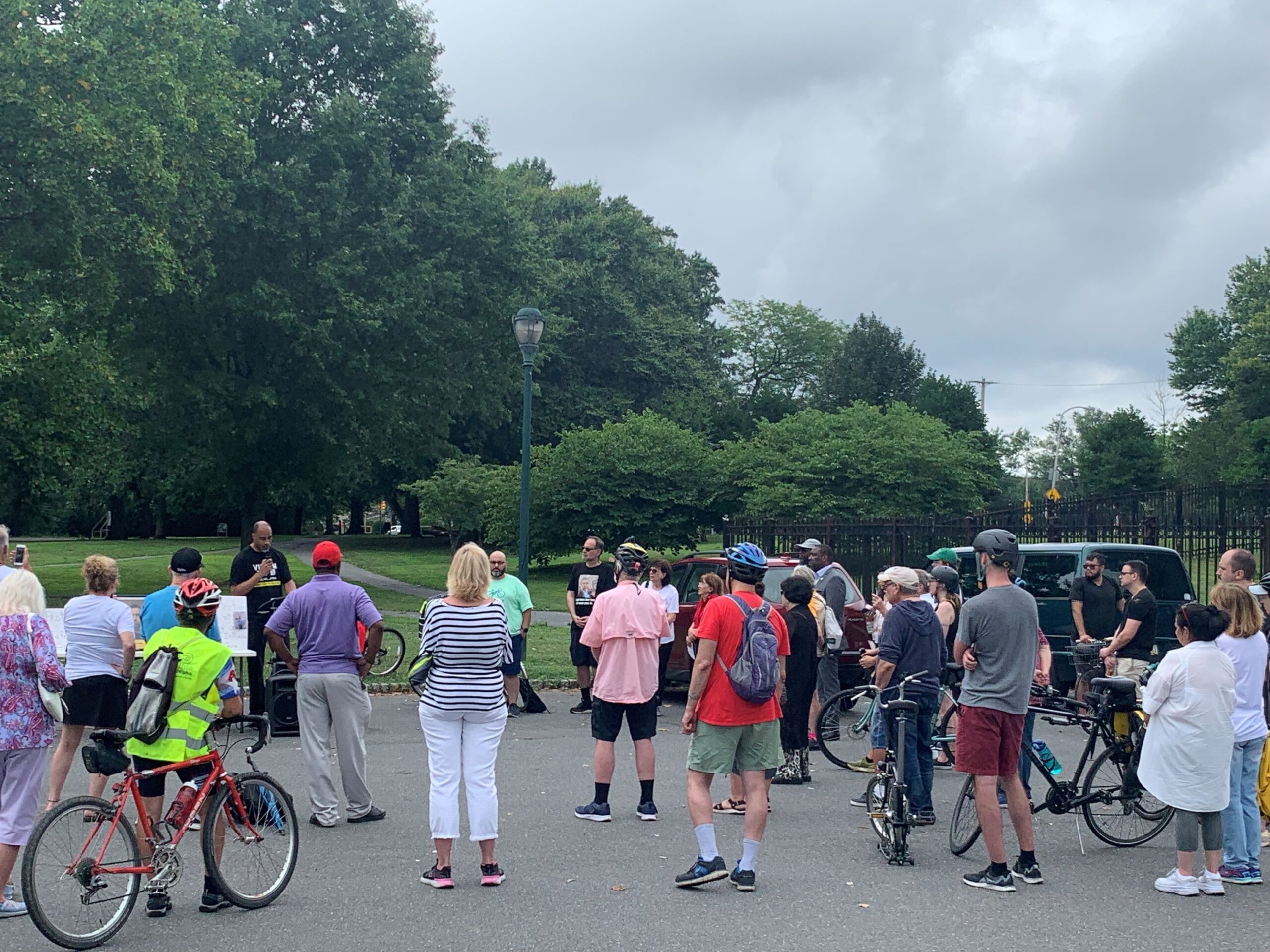 Group of bike riders listening while Michael Carroll (OTIS) speaks.