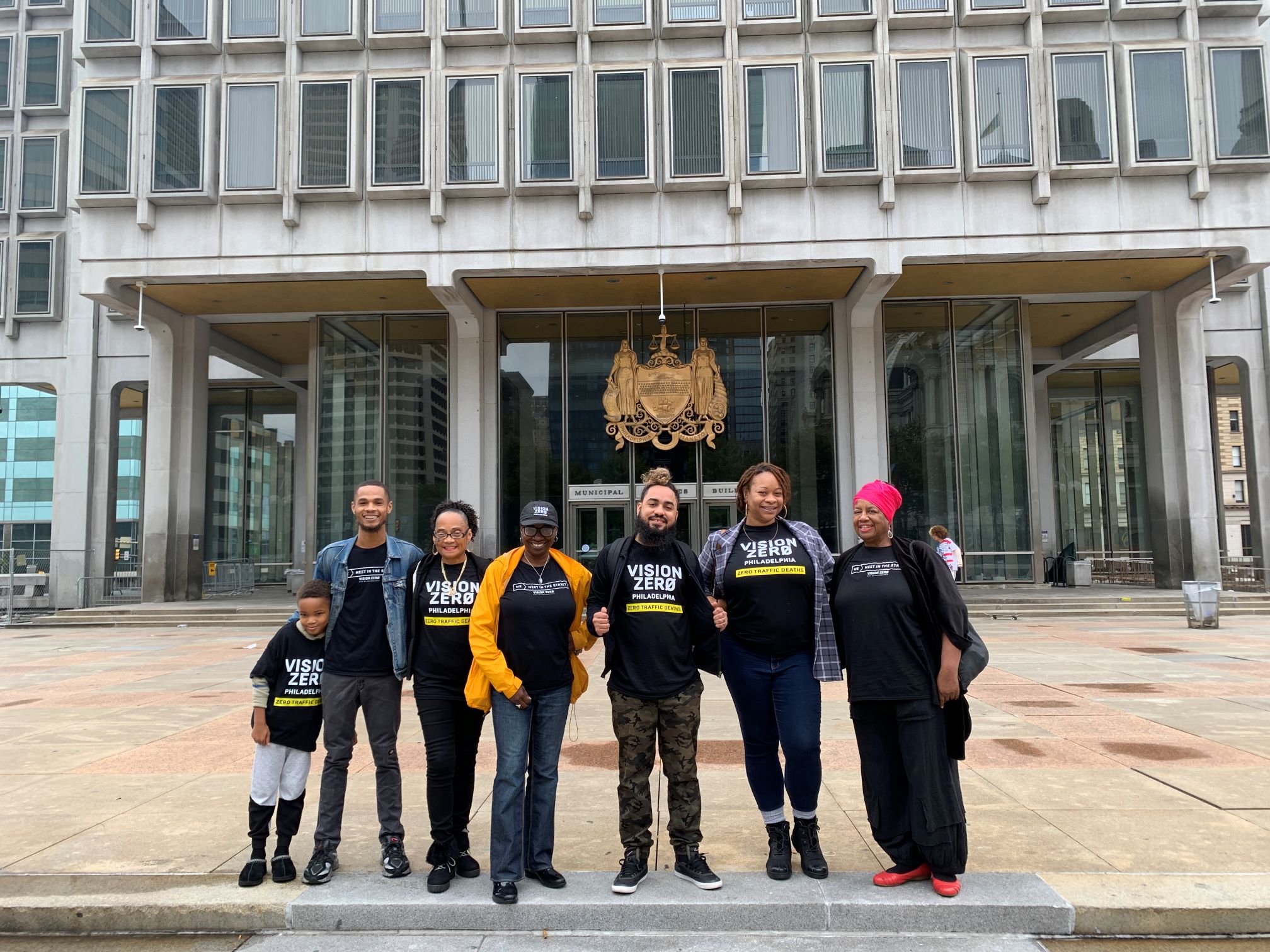 Image of former Vision Zero Ambassadors standing in front of the Municipal Services Building.